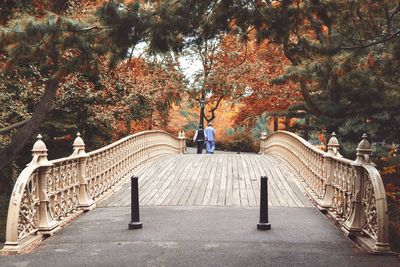 People walking on bridge