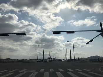 Road sign against sky