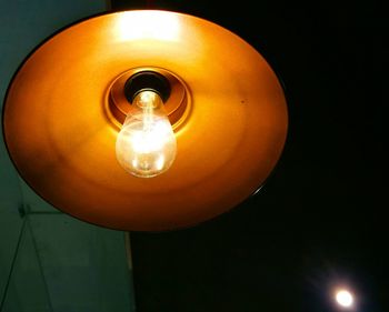 Low angle view of illuminated light bulb