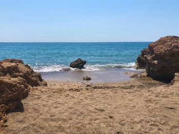 Scenic view of sea against clear sky