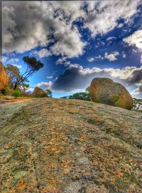 Rocks on landscape against sky