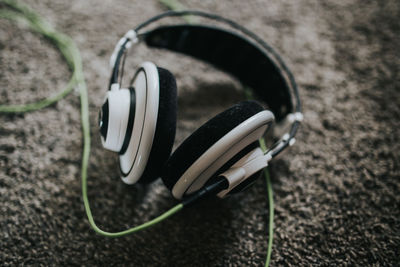 Close-up of headphones on rug