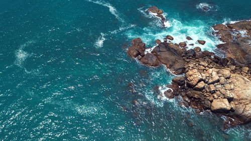 High angle view of rock formation in sea