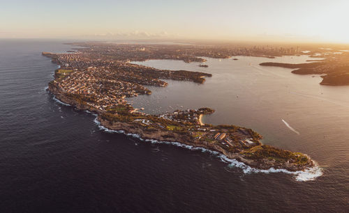 Drone view of south head, watsons bay with sydney harbour, cbd and harbour bridge in the background