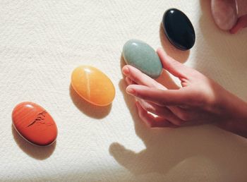 Cropped hand of woman holding pills