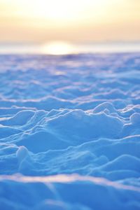 Snowy beach at the baltic sea coast during sunrise