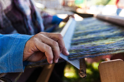 Close-up of man working on wood