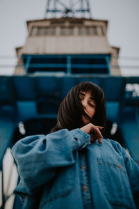 Portrait of a young woman standing outdoors