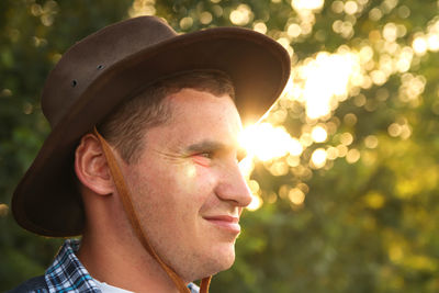 Close-up of man wearing hat
