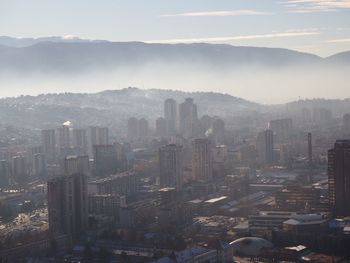 High angle view of buildings in city against sky