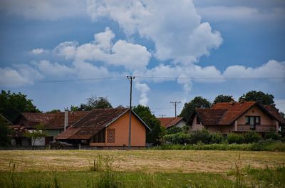 House on field against sky