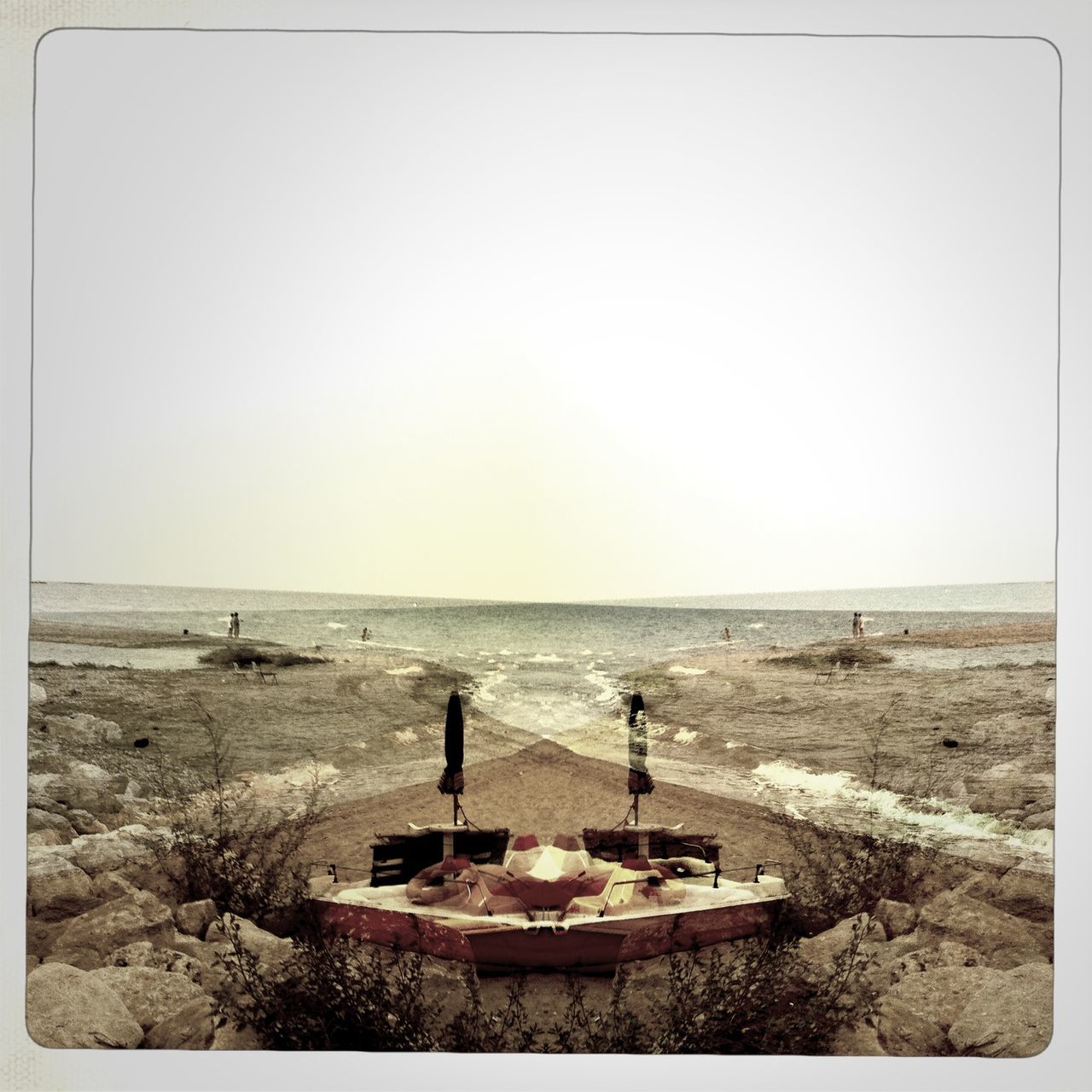 water, sea, horizon over water, clear sky, transfer print, copy space, tranquil scene, beach, auto post production filter, tranquility, scenics, shore, nature, beauty in nature, rock - object, sky, outdoors, idyllic, incidental people, remote