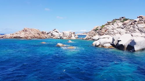 Scenic view of sea against clear blue sky