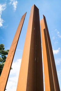 Low angle view of modern building against blue sky