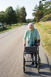 Senior woman with walking frame