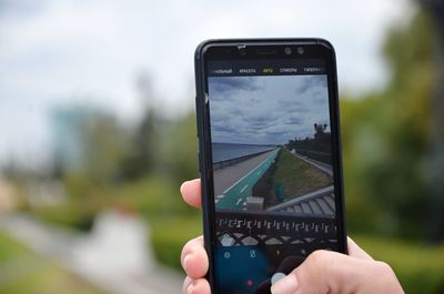 Close-up of hand holding smart phone