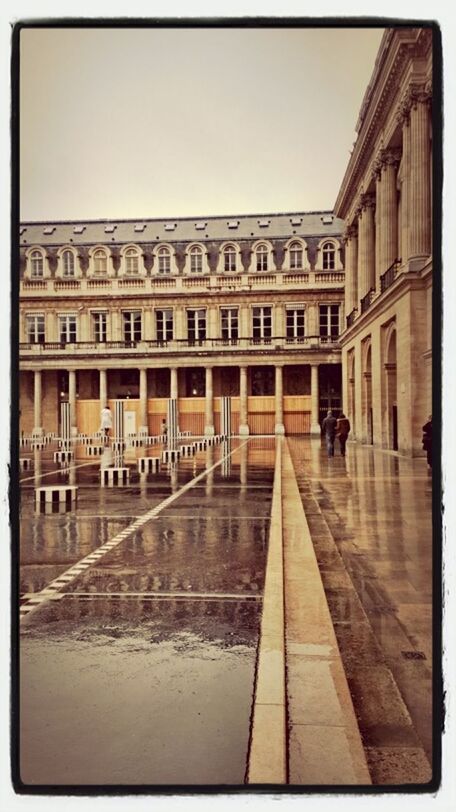 architecture, built structure, transfer print, building exterior, clear sky, auto post production filter, city, building, water, travel destinations, men, city life, incidental people, copy space, large group of people, outdoors, day, reflection, walking