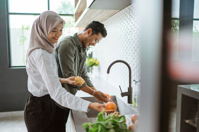 Side view of man working at home