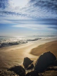 Scenic view of beach against sky