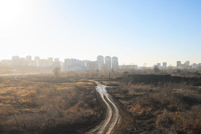 Aerial view of city buildings against clear sky