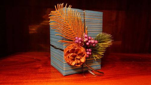 Close-up of flowers on wooden table