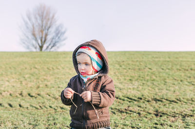 Full length of man standing in field