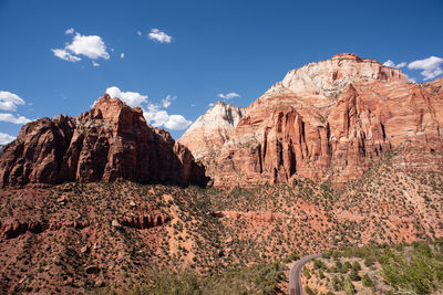 Rock formations on landscape against sky