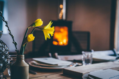 Close-up of daffodils in pot on restaurant table