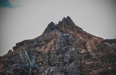 Low angle view of rock formation against sky