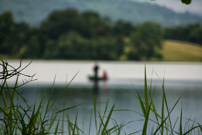 Reflection of man in lake