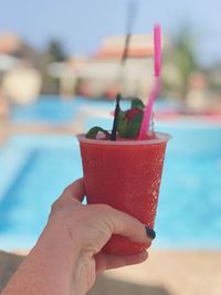 Close-up of hand holding drink