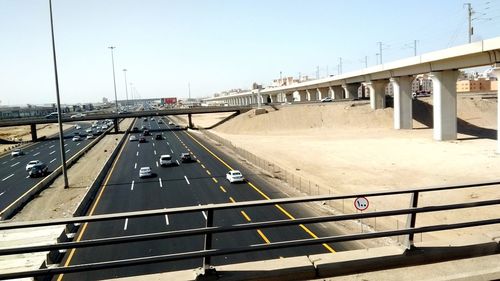 Bridge over road against clear sky