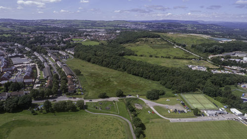 High angle view of green landscape against sky