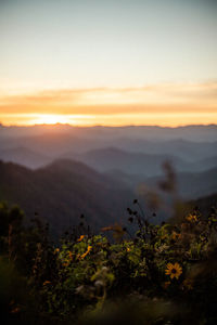 Scenic view of mountains against sky during sunset