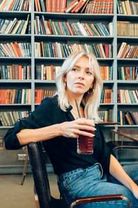 Young woman looking at book