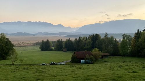 Scenic view of field against sky during sunset