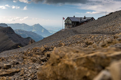 Scenic view of sea and mountains against sky