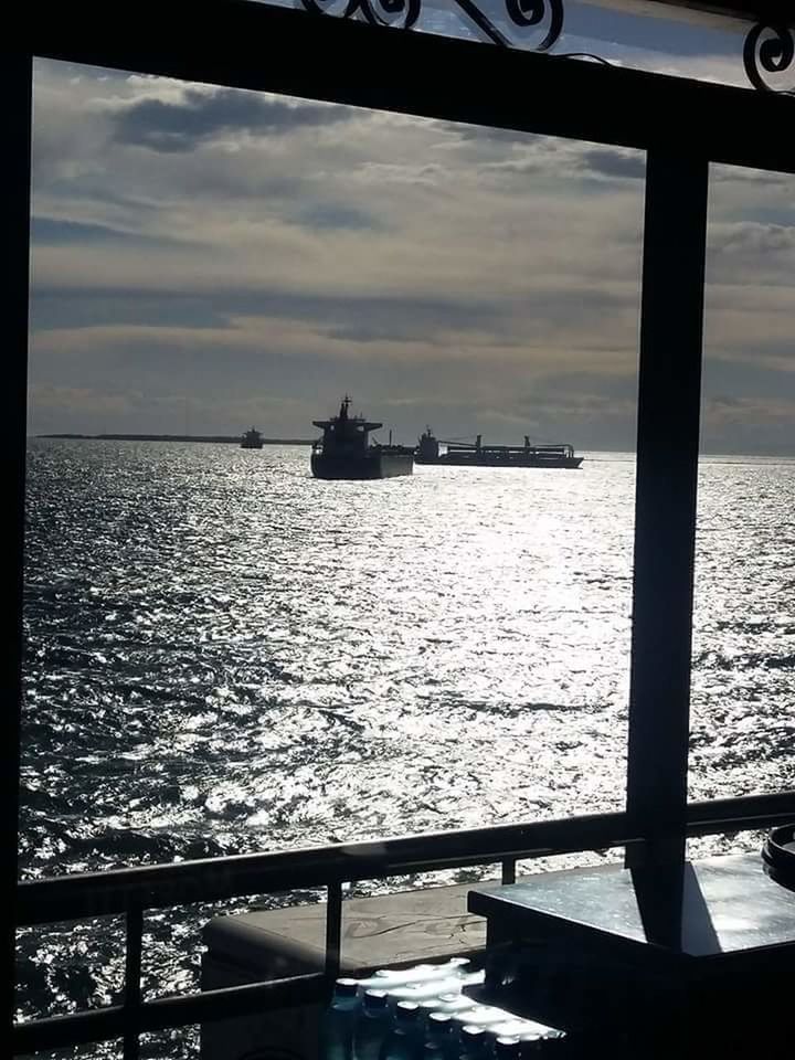 BOATS ON SEA AGAINST SKY