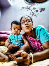 Portrait of happy friends sitting outdoors