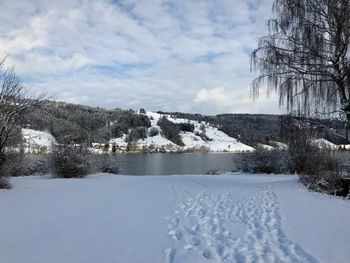 Scenic view of frozen landscape against sky