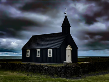 Built structure against cloudy sky