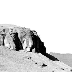 Rock formations on land against clear sky