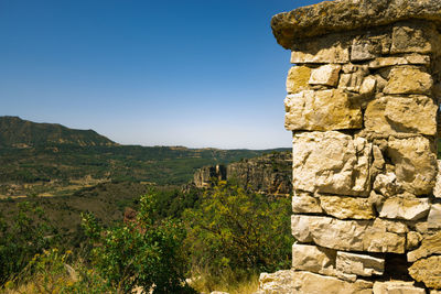 View of stone wall against clear sky