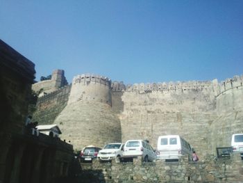 Ancient structure against clear blue sky