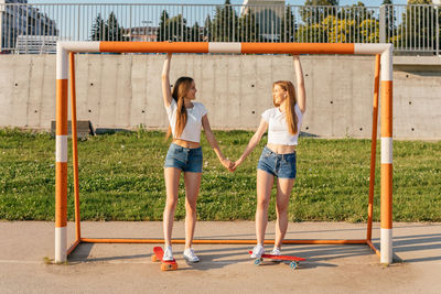 Two teenage sisters skating together
