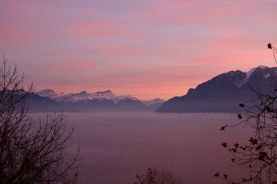 Scenic view of mountains against cloudy sky