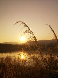 Scenic view of lake against sky during sunset