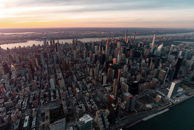 High angle view of city buildings during sunset