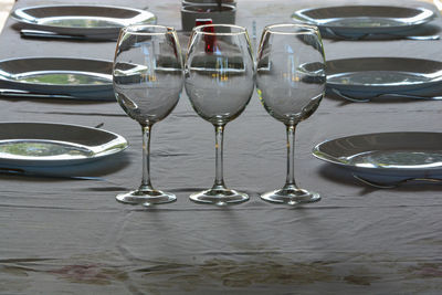 Close-up of wine glasses on table