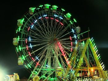 Low angle view of ferries wheel against sky